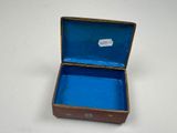 a small blue box with a sticker on it