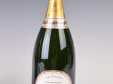 an image of a bottle of champagne next to a glass of wine