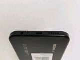 the back of a black cell phone with a white background