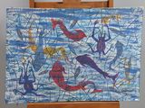 a painting on a easel with a painting of fish on it