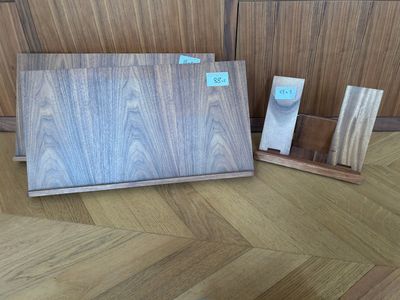 two pieces of wood are sitting on the floor next to each other