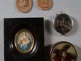 a picture of a picture of jesus and other religious items on a table