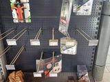 a display of tools on the shelf in the store