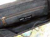 a purse with a label on it that says paul marridge