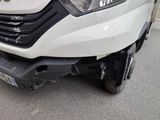 a close up of a white truck with a front bumper