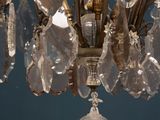 a chandelier that has a lot of crystals hanging from it