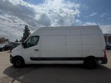 a white van parked in a parking lot on a sunny day