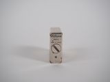 a small box of pills sitting on a white surface