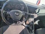 the interior of a car with a steering wheel and dashboard controls