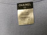 chanel t - shirt in light blue with black and white logo on the front