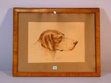 tableau représentant un chien brun, dans un cadre en bois, accroché au mur