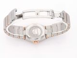 an image of a silver and gold wrist watch on a white background