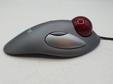 a computer mouse with a red ball on top of it