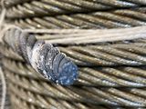 a close up of a coil of silver colored wire on a table