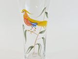 a glass vase with a bird painted on it