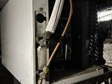 a white box that has a bunch of wires inside of it