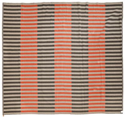 an orange and grey striped rug on a white background