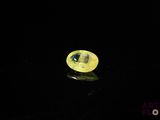 an image of a yellow diamond on a black surface