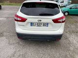 a white car that is parked in a parking lot