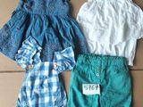 three pieces of clothing sitting on top of a cardboard box