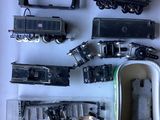 a lot of toy trains that are sitting on a table