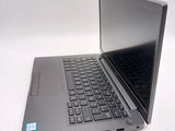 a laptop that is sitting on a table with a keyboard