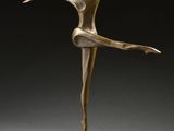 a bronze statue of a ballerina on a pedestal