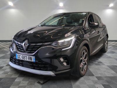the front of a black renault c - cross parked on a checkered floor