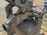 a machine that is sitting on a pallet in the grass