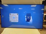a tv screen that has a qr code on it