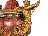 a large vase with a statue on top of it