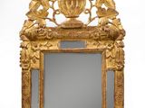 an image of a gold framed mirror with flowers and leaves on it