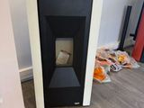 a black and white fireplace in the corner of a room