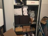 many boxes and boxes on a shelf in a room