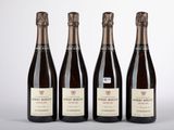 trois bouteilles de vin posées l'une à côté de l'autre sur une table