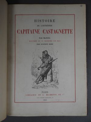 un livre ouvert sur lequel figure l'image d'un chat tenant un pistolet