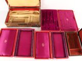a lot of different types of silverware in a box