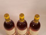 three bottles of wine sitting next to each other on a table