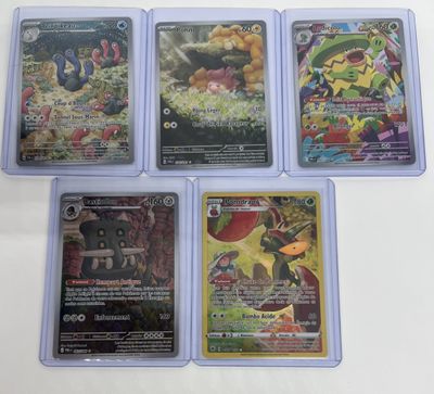 four different pokemon cards sitting on top of each other on a table