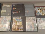many different types of stamps on the pages of a binder