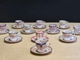 a lot of cups and saucers on the table