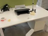 a white desk with a printer and a printer on it