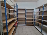 a room with a lot of shelves in it