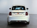 a white car that is parked in a room