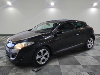 a picture of a black car parked in a garage