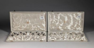 pair of silver plated serving utensils in a case