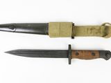 two knifes are laying next to each other on a white surface