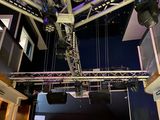 a stage set up in a building with lights on