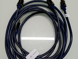 a close up of a blue cable with a white tag on it