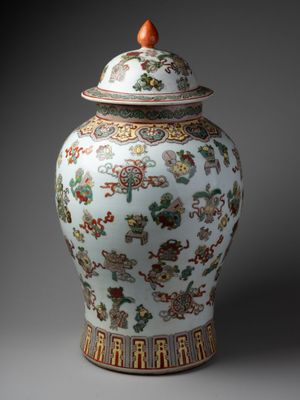 an image of a vase with a lid on a gray background
